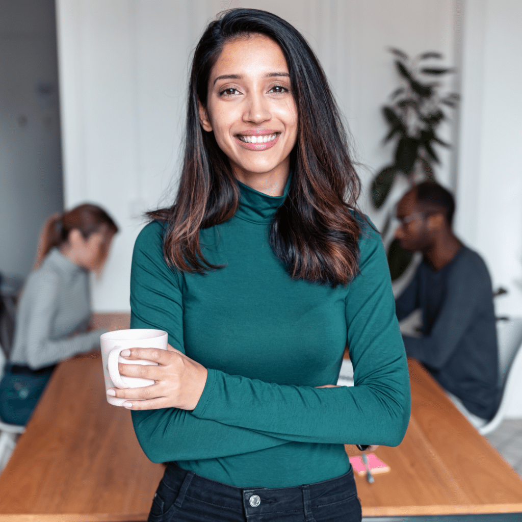 Woman Smiling Holding a cup