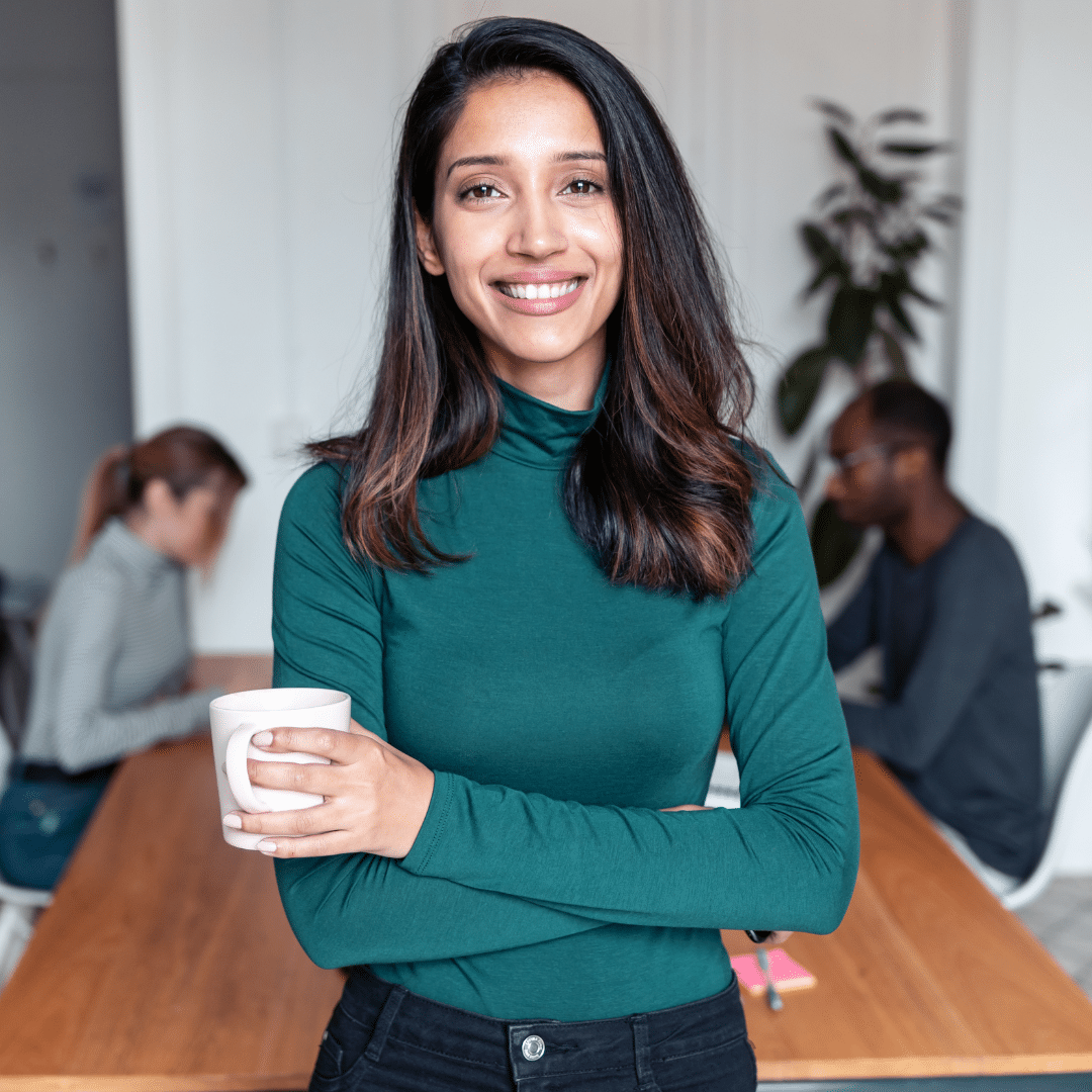 Woman Smiling Holding a cup